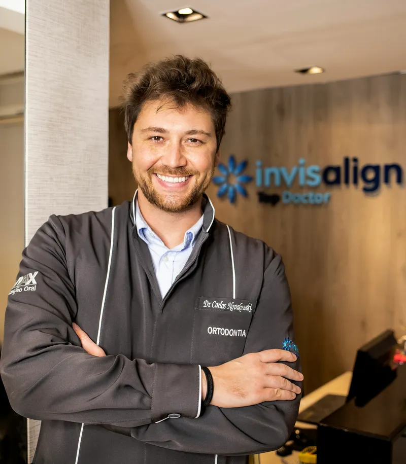 Verified dental professional standing in their clinic